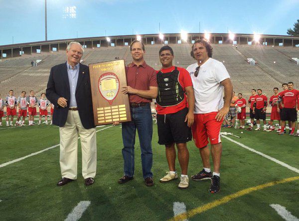 The Paul Schimoler Award was presented to Andy Phillips '84 in September 2015 by Richie Moran, Mike LaRocco '96 & Joe Lizzio '88.